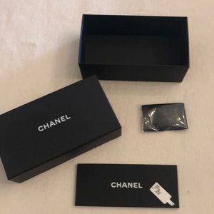 Empty Chanel sunglasses box with book wipe.